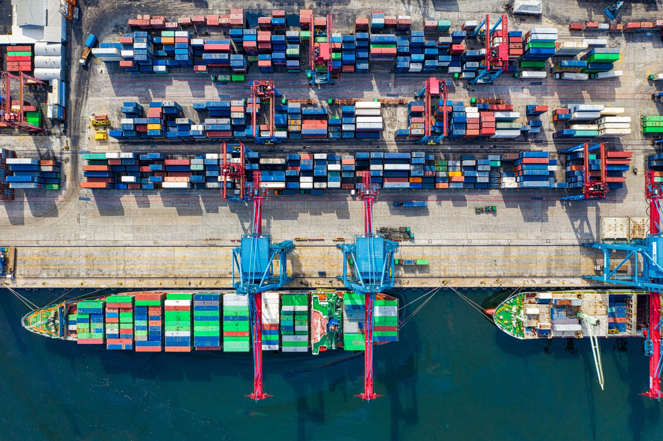 An aerial view of a container port and its connections to the sea
